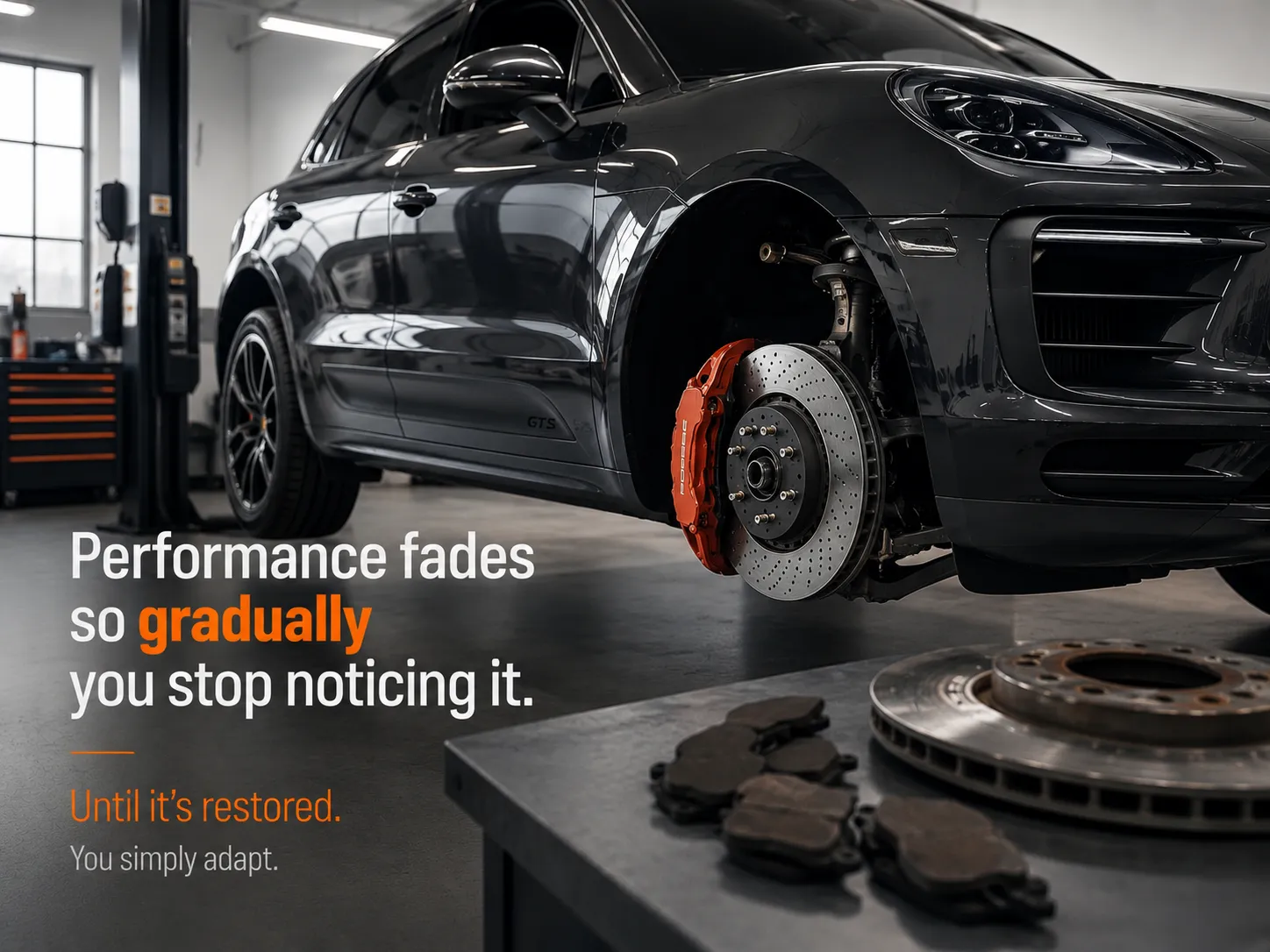 Black car on a garage lift with exposed brake rotor and pads, with text about performance fading and restoring.